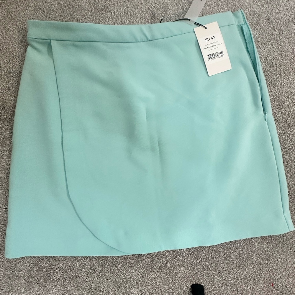 ASOS pastel mini skirt in size medium.